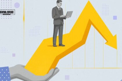 AI Tools For Affiliate Marketers: grayscale businessman reading laptop on a 3D arrow graph held by a hand.